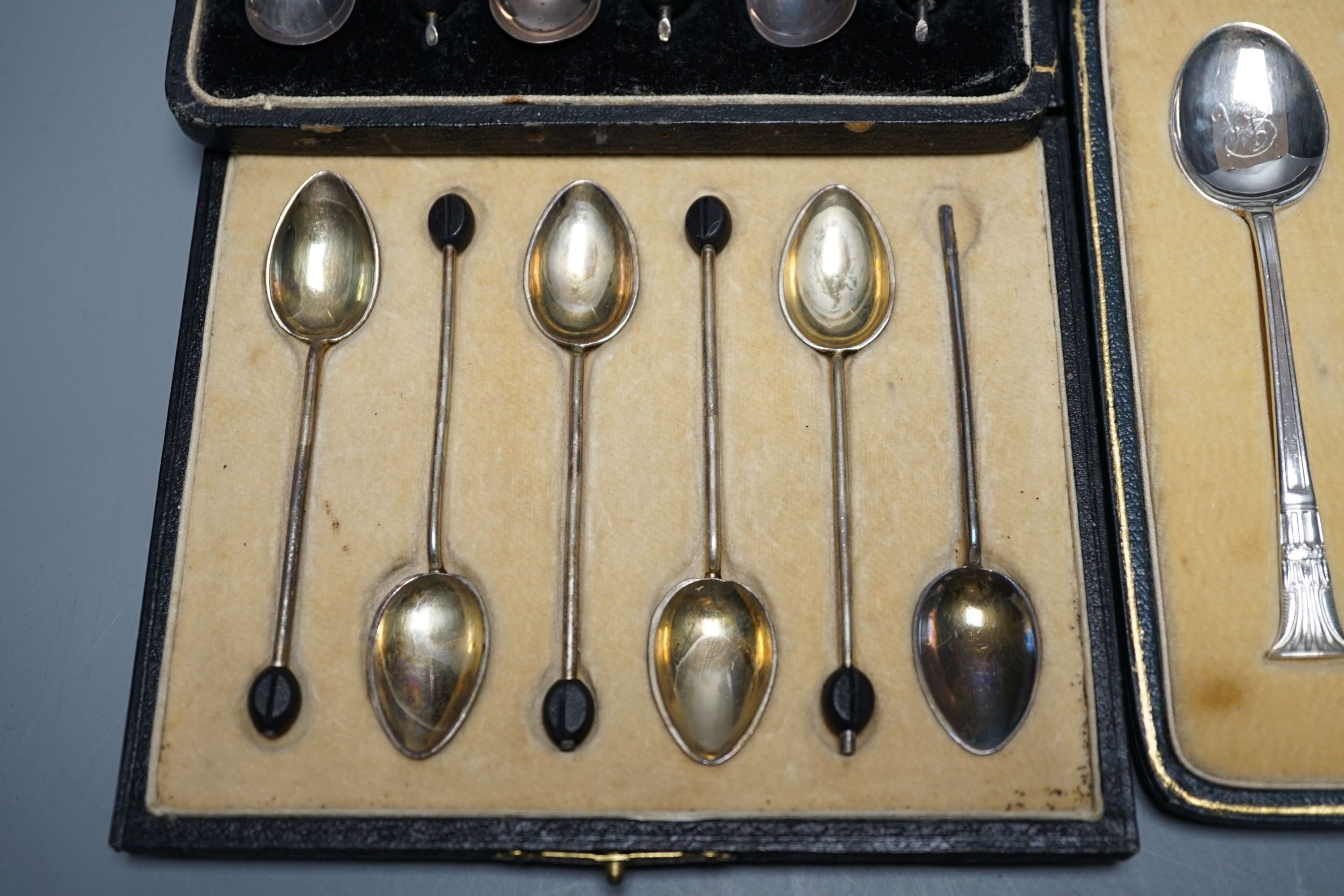 Two cased sets of six silver coffee spoons including enamel(a.f.) and bean end and three other cased sets including teaspoons with tongs, pepperettes and dish.